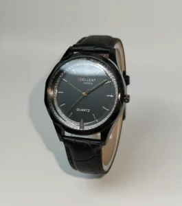 Black women’s quartz wristwatch with leather strap and minimalist dial.