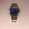 Luxury quartz men’s watch with blue dial and polished metal strap
