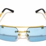 Rimless blue lens sunglasses with luxury gold frame and designer detailing