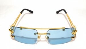Rimless blue lens sunglasses with luxury gold frame and designer detailing